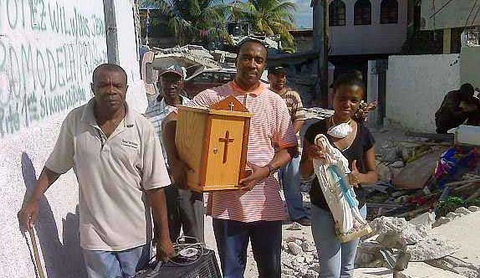 A tabernacle and a statue of Mary saved from the debris of a destroyed church in Haiti
