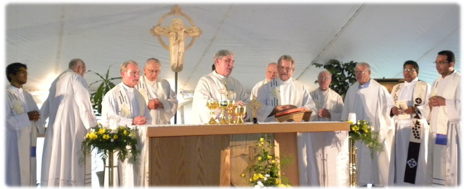 Schoenstatt and Pallotine Fathers celebrating the opening Mass with Bishop Jerome Listecki, Archbishop of Milwaukee on the Exile Shrine grounds.
